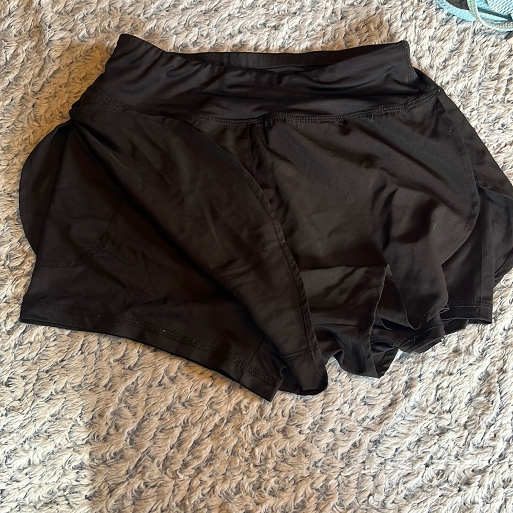 Black women’s athletic shorts with spandex lining on the inside